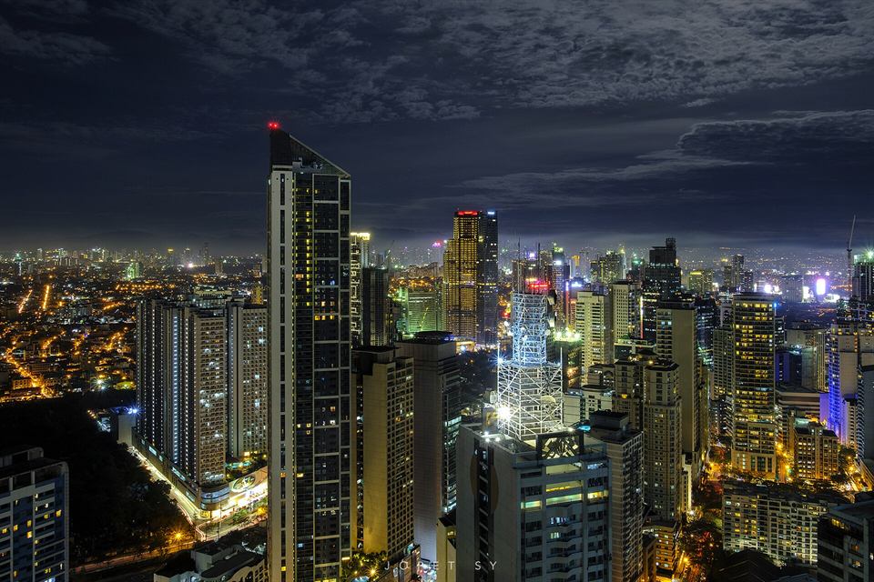 Makati's towers lit at blue hour