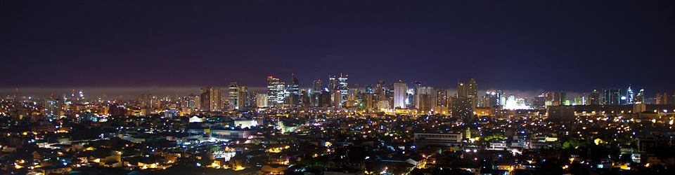 The towers of Makati lit at night