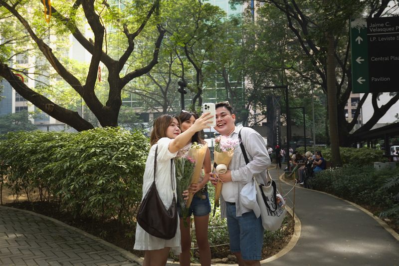 Young residents taking a photo together in a park