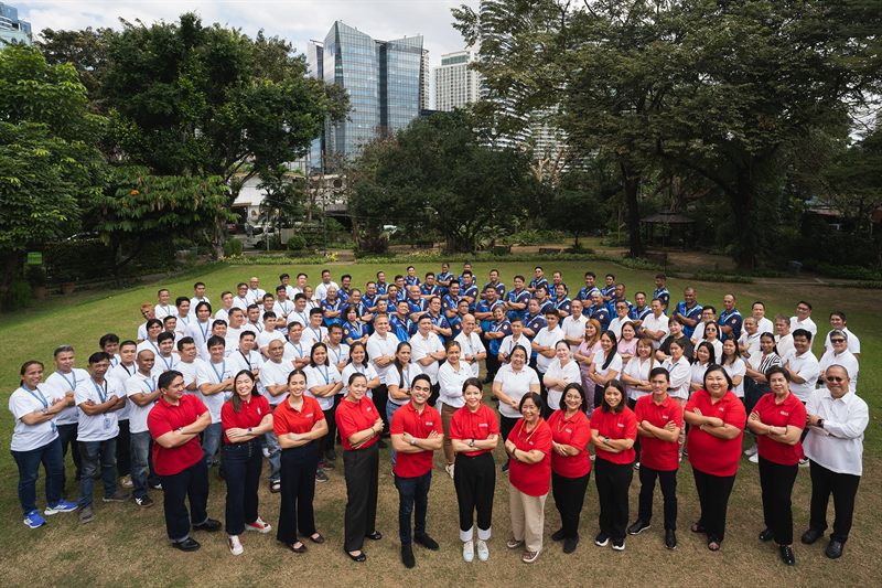 Barangay staff gathered on a lawn