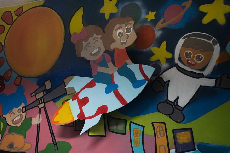 A colourful children's mural at the day-care centre