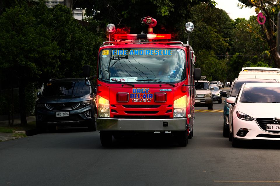 The barangay fire truck on a tree-lined street