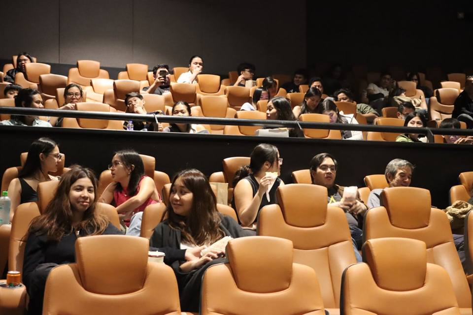 Residents in cinema seats before a free screening