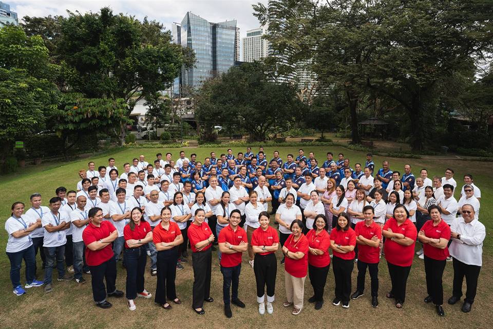 Barangay staff gathered on a lawn